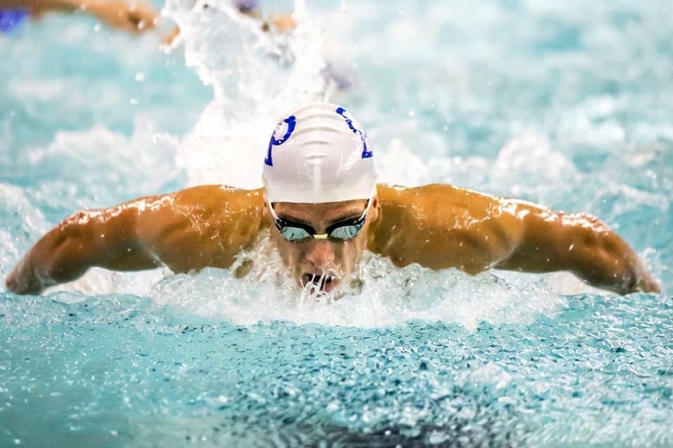 Swimmer locking focus while powering through butterfly strokes